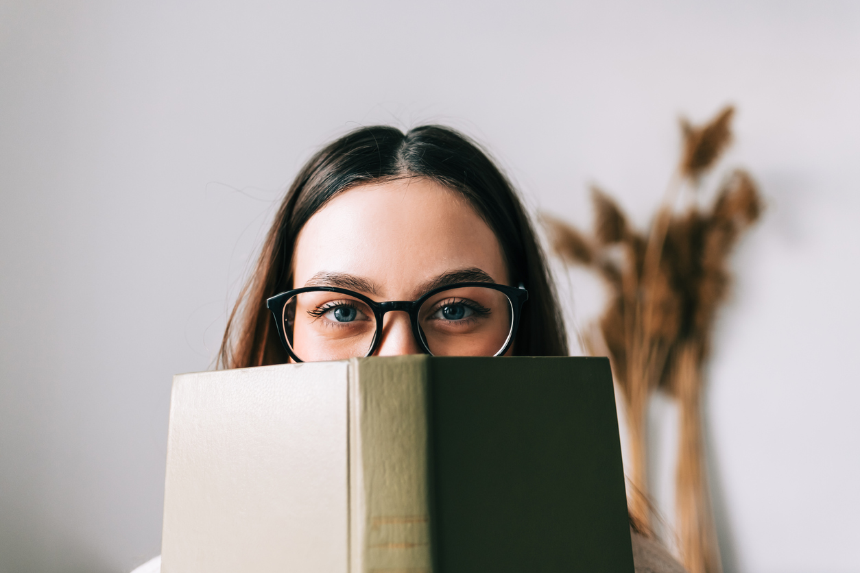 woman reading book on how to cope with bipolar disorder