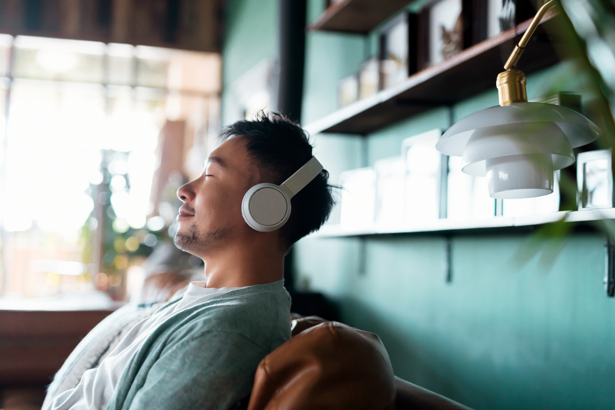 man listening to music, one of many coping skills for adults with anxiety
