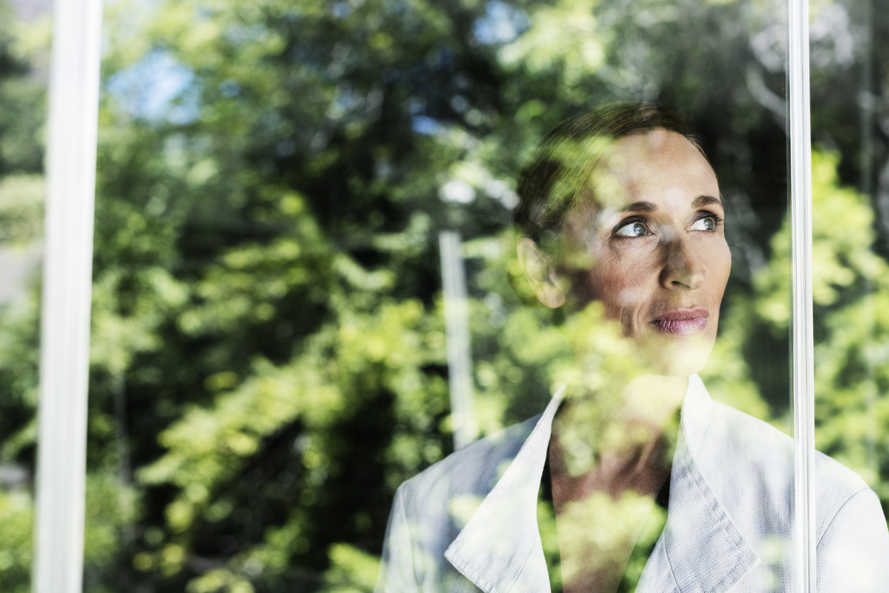 woman looking out window, wondering about the types of borderline personality disorder