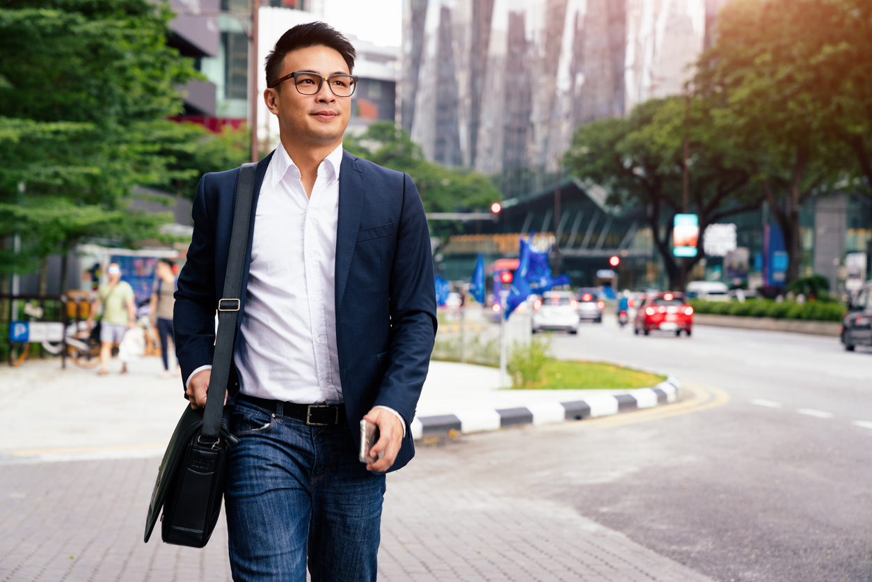 man calmly walking to work after learning How to Reduce Anxiety and Depression