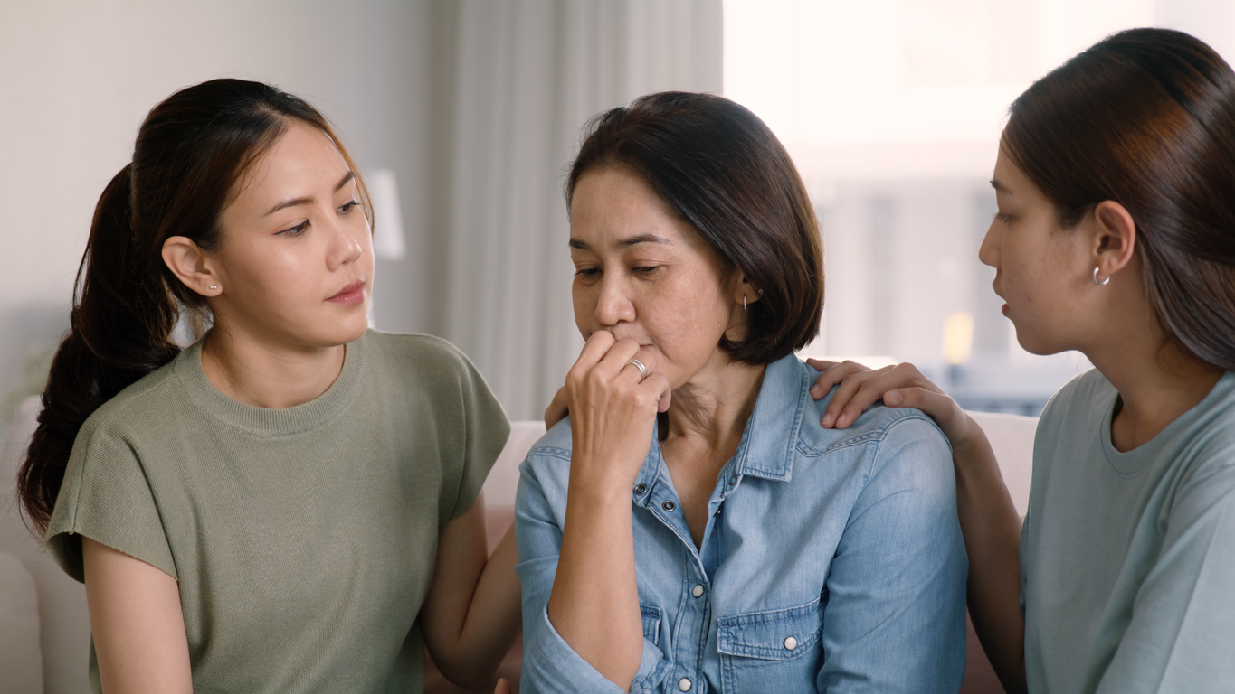 woman being comforted after displaying Signs of Drug Addiction in Adults