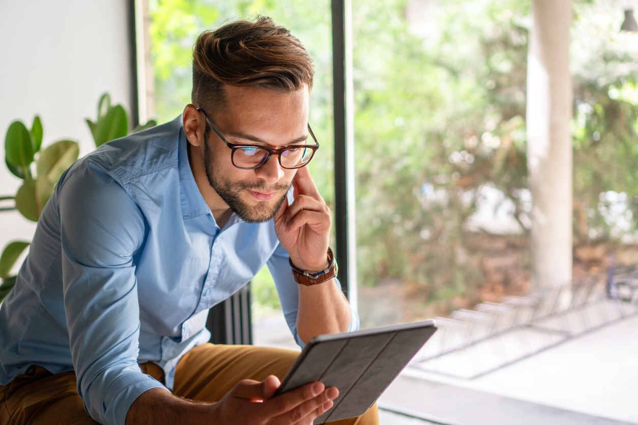 man reading about what causes mental health problems