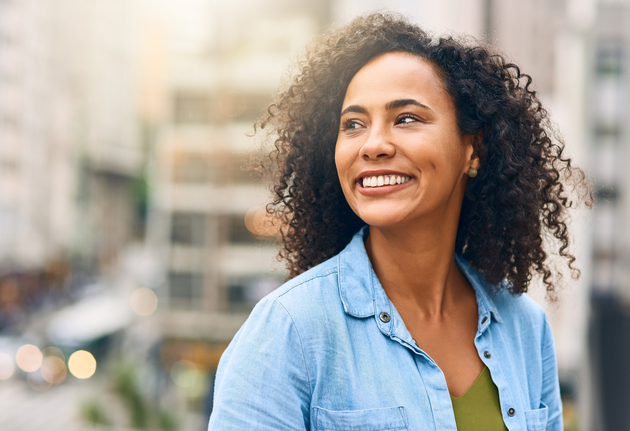 Smiling woman after asking how does bipolar disorder affect the brain