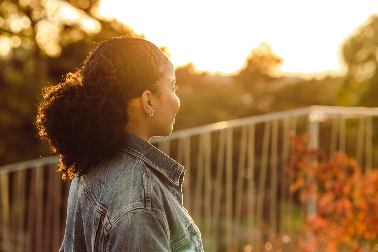 woman looking outside, wondering how to break the cycle of obsessive thoughts