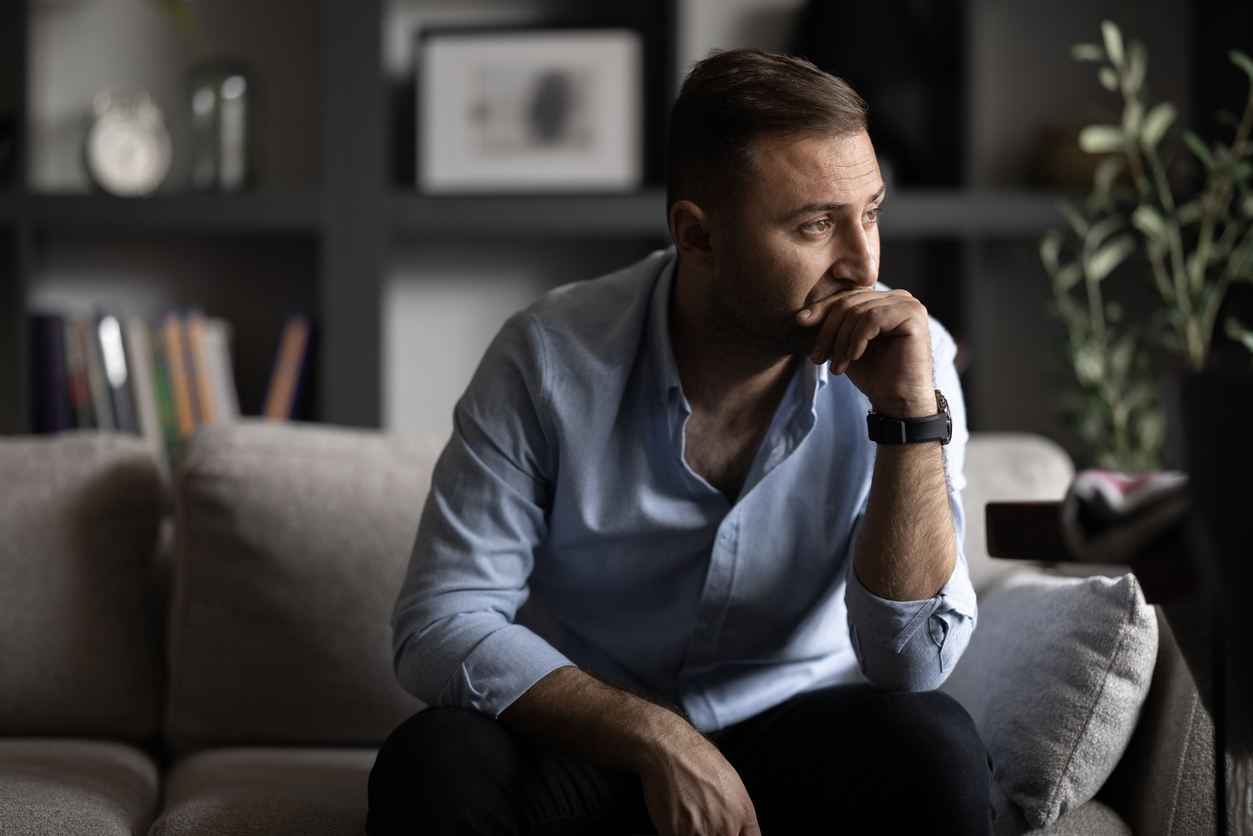 man worried, experiencing symptoms of anxiety and alcoholism cycle