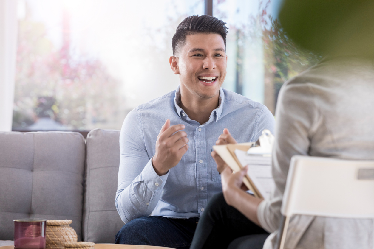 man smiling about the potential benefits of ketamine-assisted psychotherapy